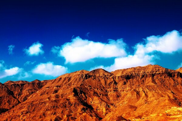 Sandy mountains under clouds
