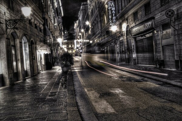 The evening is dark and only the tram warms
