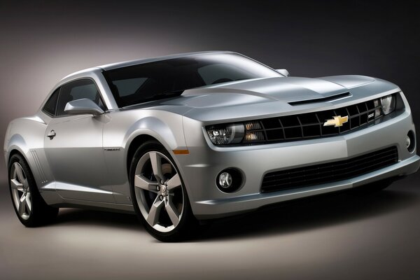 A gray Chevrolet stands on a gray background