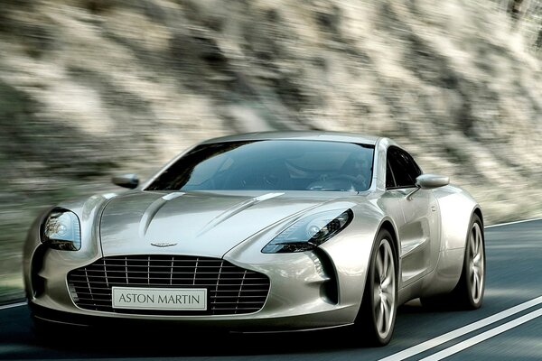 Silver Aston Martin on the track