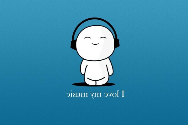 The little man listens to music with headphones