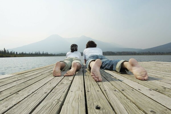 A couple in love is resting and looking at the water