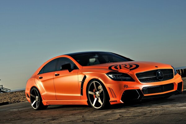Red Mercedes on the road background
