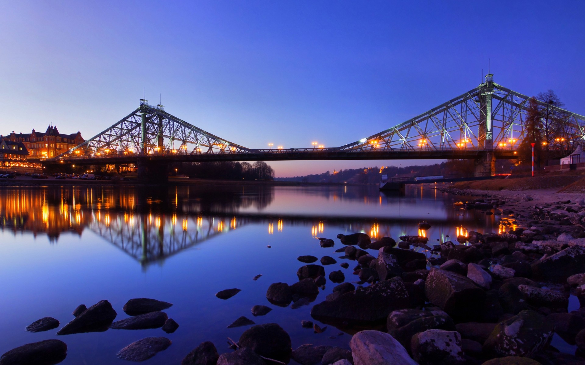 germany bridge water sunset travel evening river transportation system architecture dawn suspension bridge dusk construction sky vehicle city sea light reflection blaues wunder stones night lights landscape background