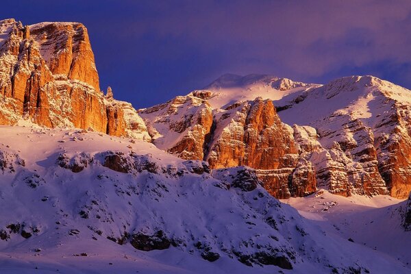 Travel through snowy, picturesque mountains in Italy