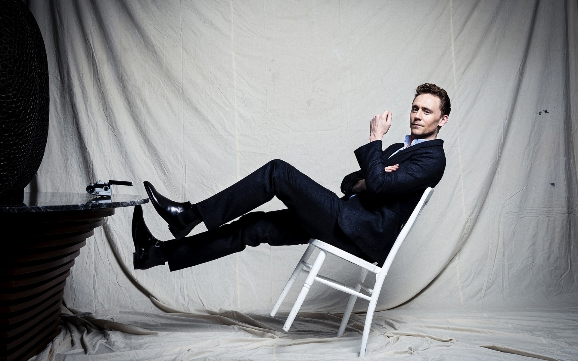 men one adult chair portrait indoors room man seat woman performance tom hiddleston actors celebrity