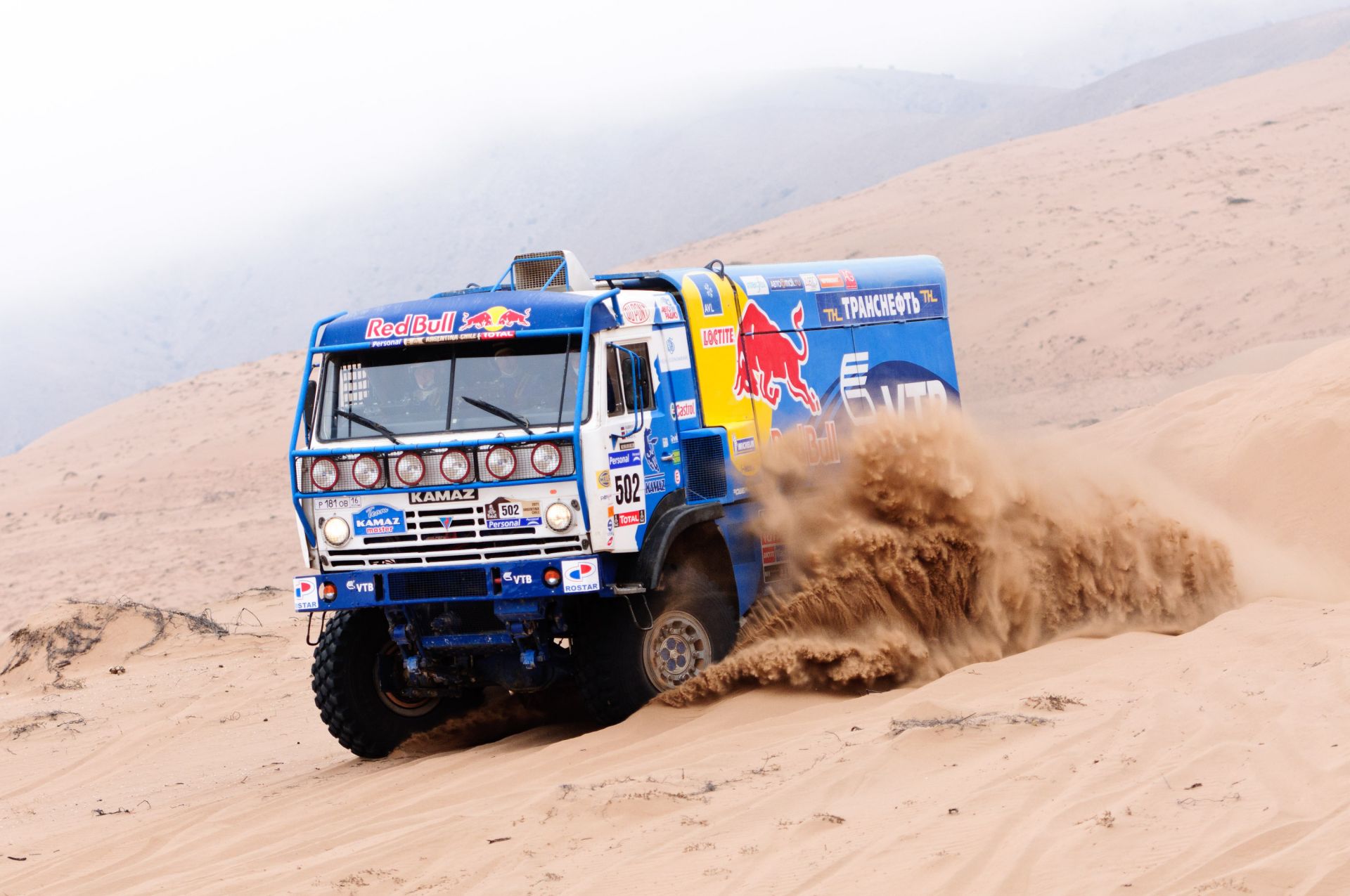 trucks sand vehicle dust truck rally race transportation system car soil travel track desert mud road adventure drive gravel wheel fast