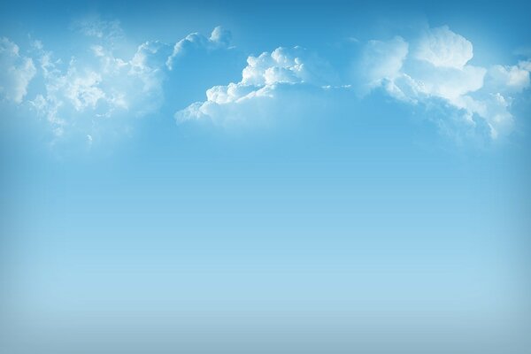 Fluffy clouds in a blue sky