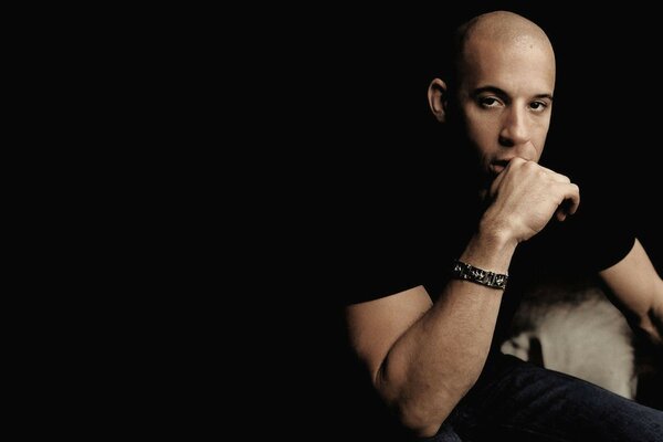 Vin diesel vin diesel actor sitting dark background male