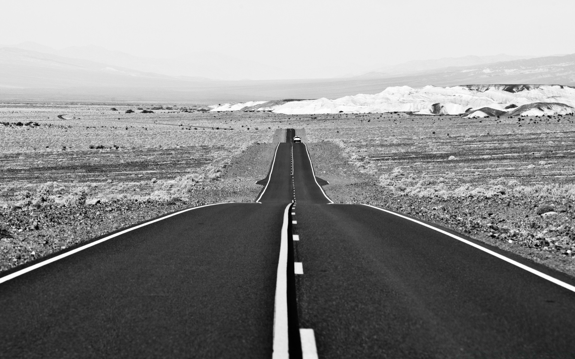 black and white highway road asphalt landscape travel transportation system street empty desert sky monochrome guidance expressway outdoors