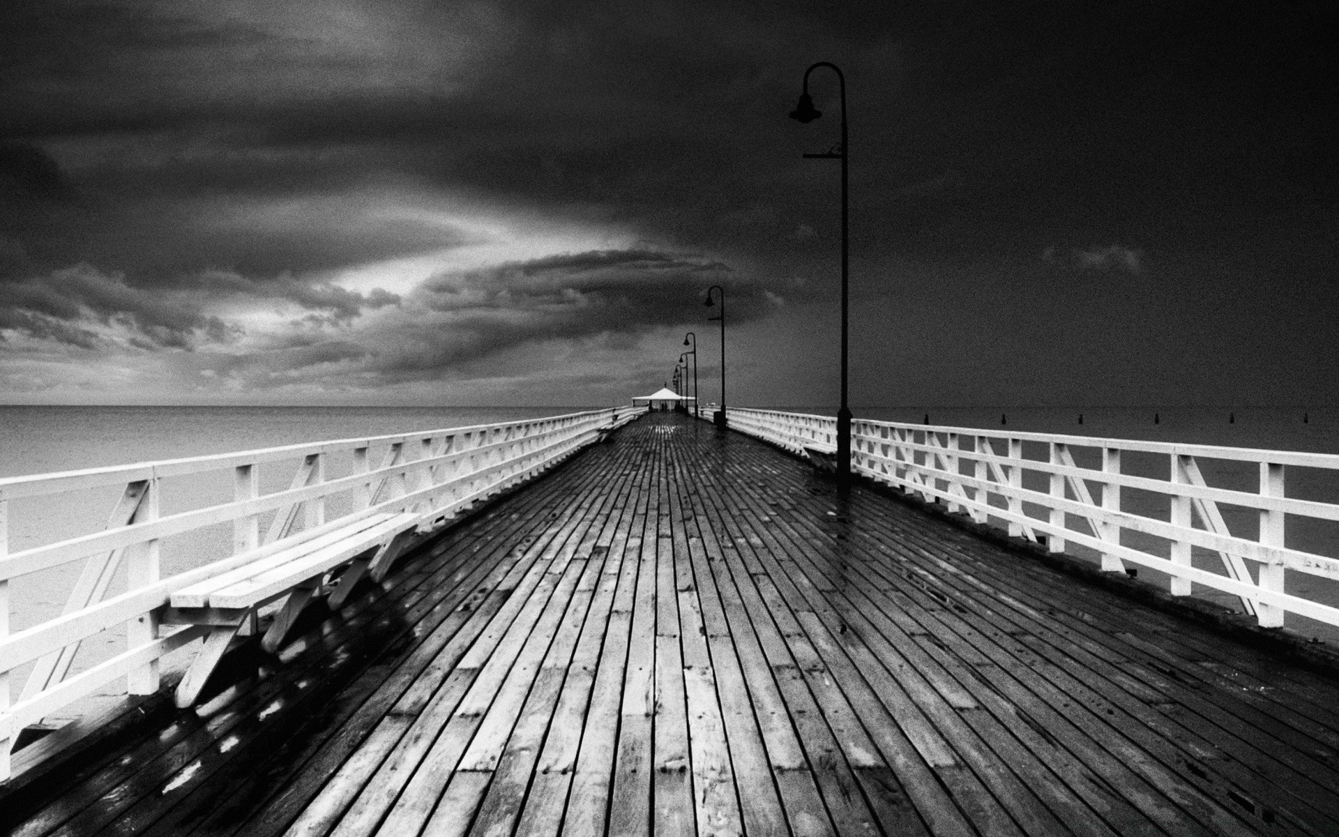 black and white monochrome sea beach pier water bridge ocean sky transportation system landscape travel light street sunset dawn