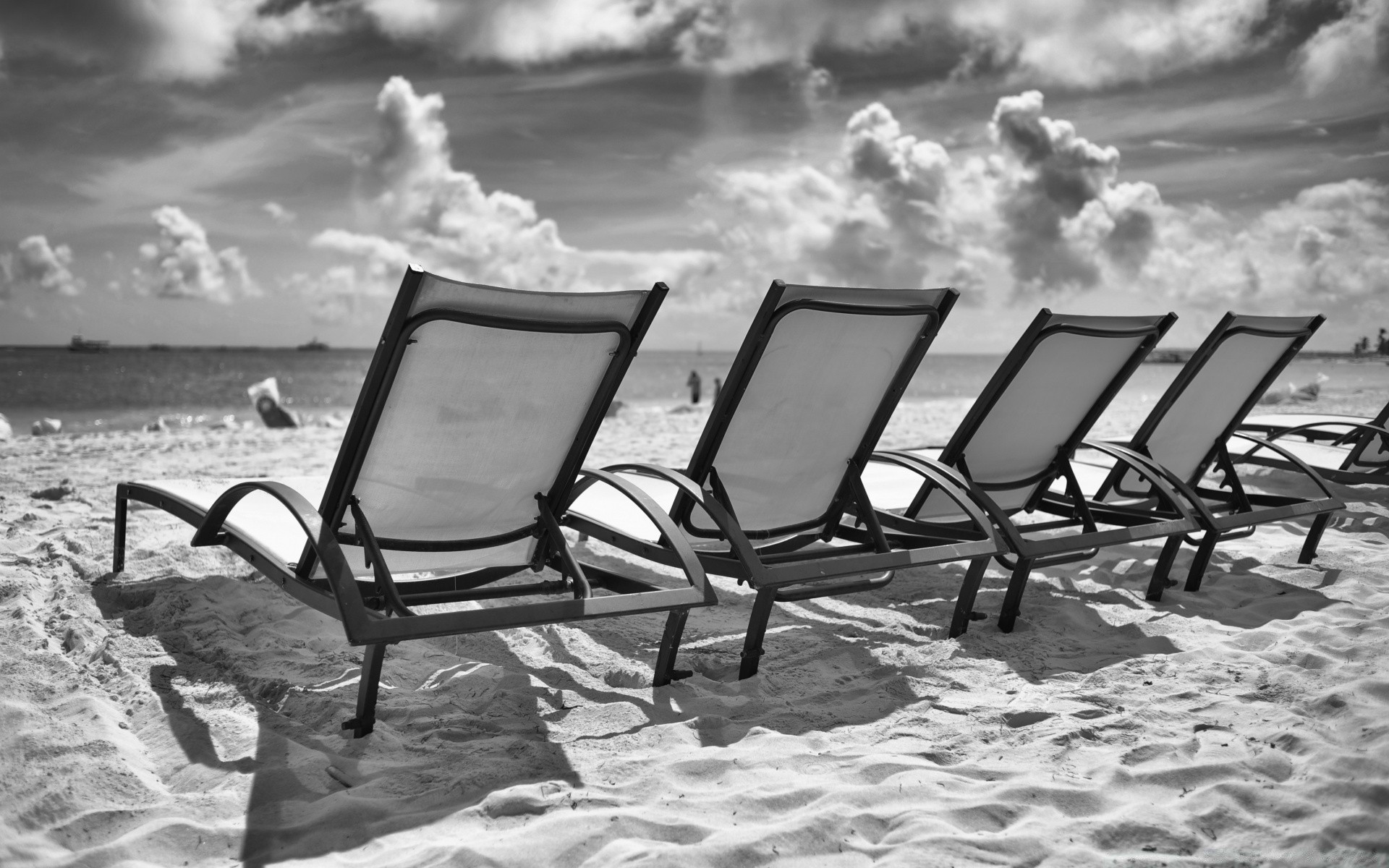 black and white beach chair sea ocean water seashore sun sand rest travel summer relaxation vacation seat bench leisure empty resort sky