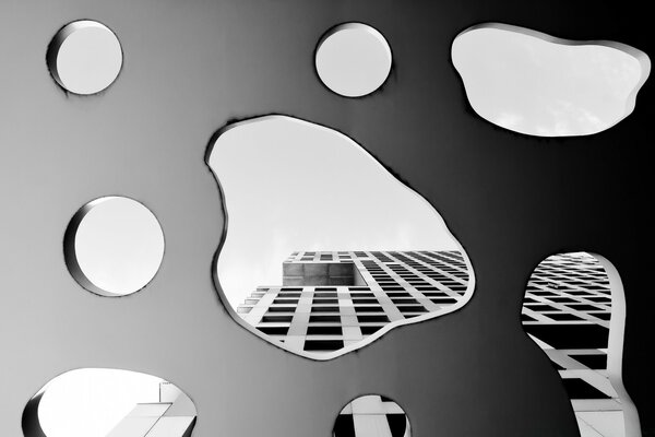 Reflection of a building in water droplets