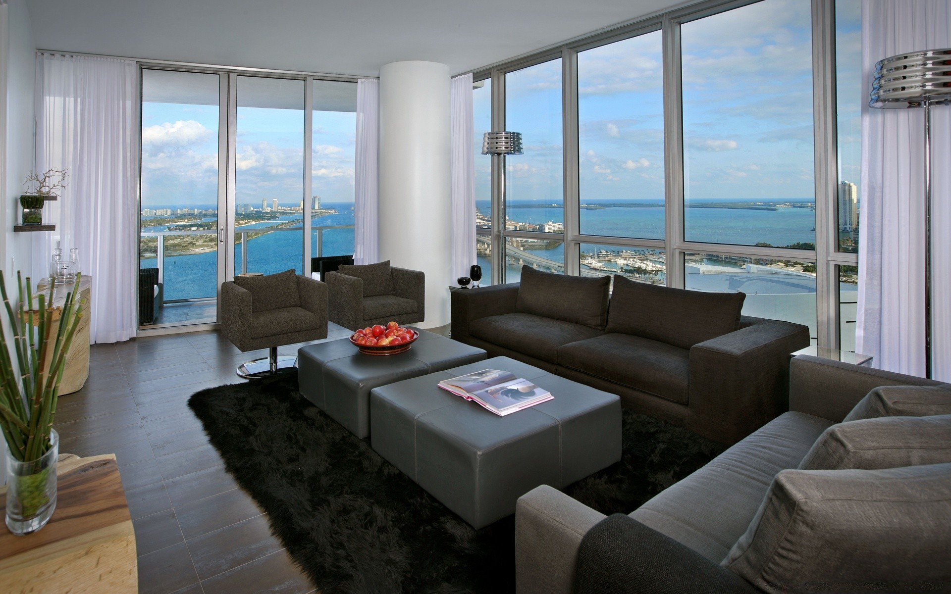 house and comfort furniture window room indoors sofa seat chair contemporary table floor interior design apartment home house luxury rug coffee table family easy chair inside