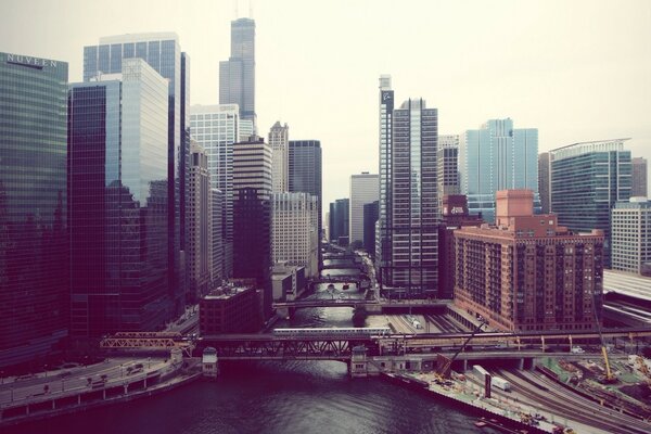 TRAIN ON THE BACKGROUND OF A BIG CITY