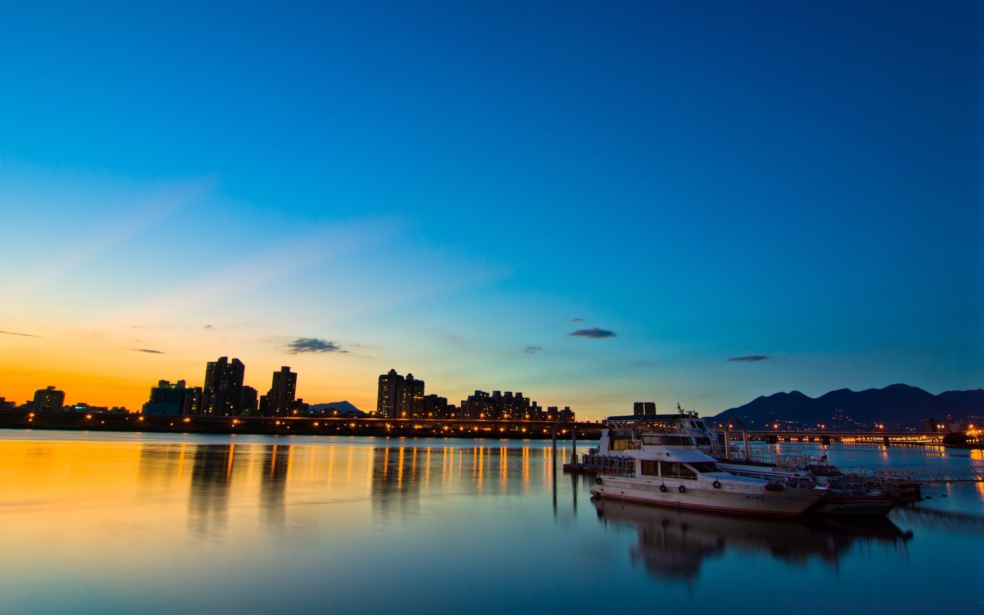 other city sunset water dusk sky travel dawn evening city reflection architecture sea outdoors