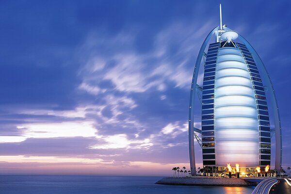 The sail tower with its spire reaching into the sky at sunset