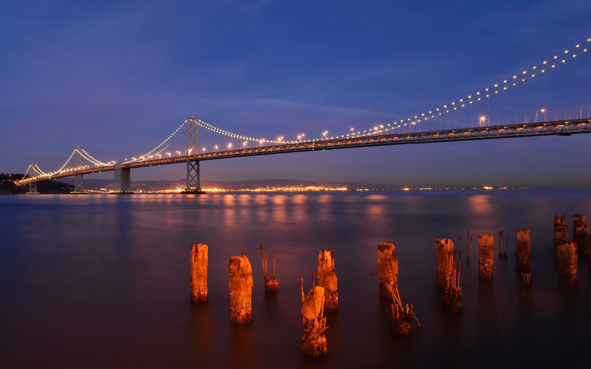other city bridge suspension bridge water sunset evening river architecture travel dusk city suspension sky connection reflection transportation system dawn suspend