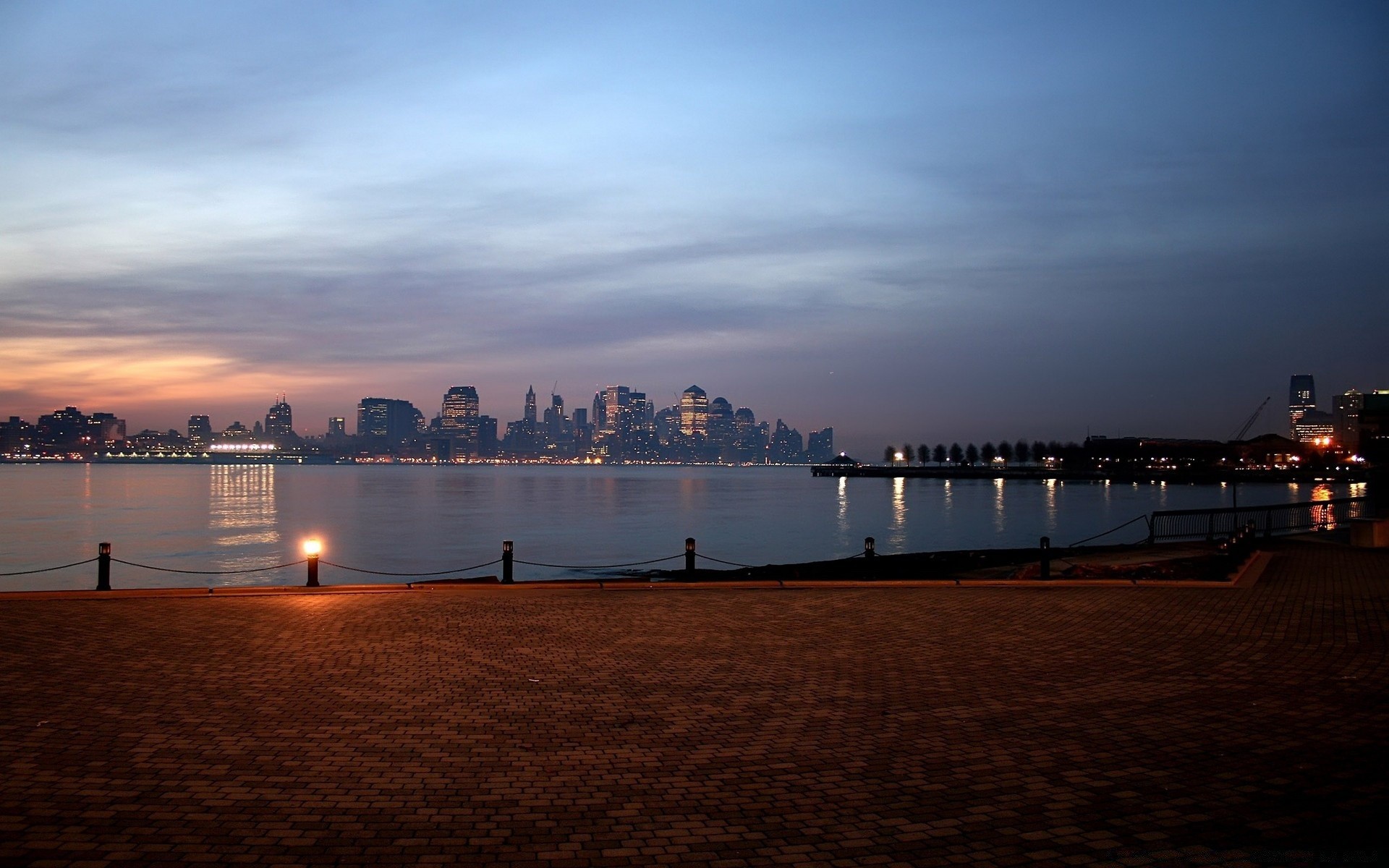 other city sunset water sea dawn city evening dusk pier travel architecture harbor bridge river beach skyline cityscape sky reflection sun