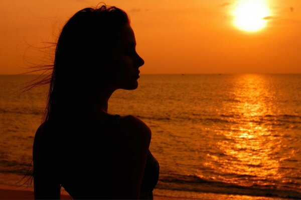 Sexy girl on the sea in the shade