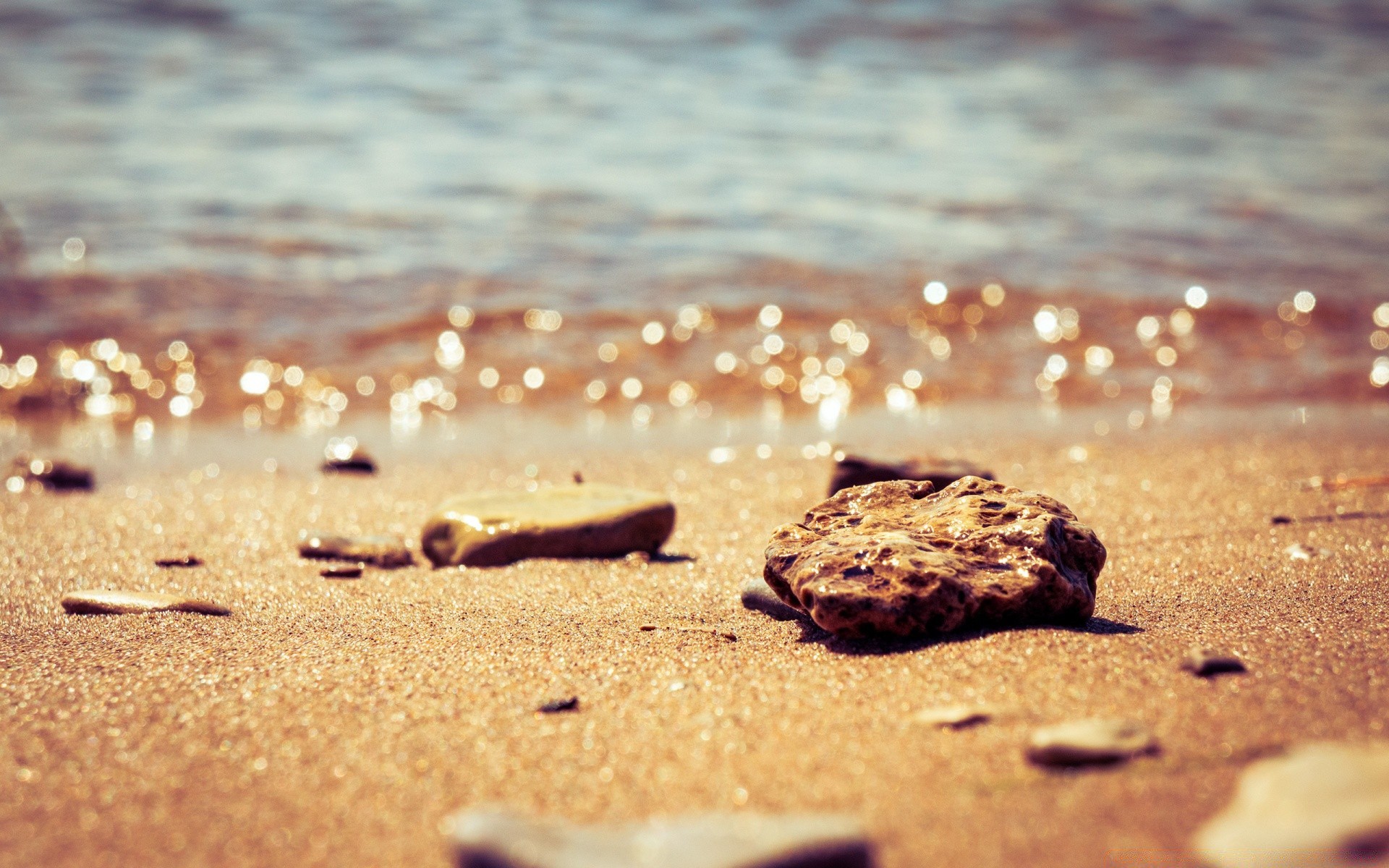 bokeh beach sand seashore sea water ocean nature vacation shore summer travel sun outdoors seaside fair weather wet