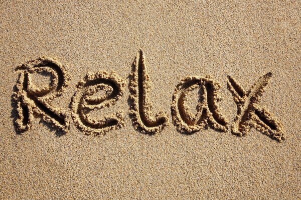 Inscription words on the sand on the beach of the sea