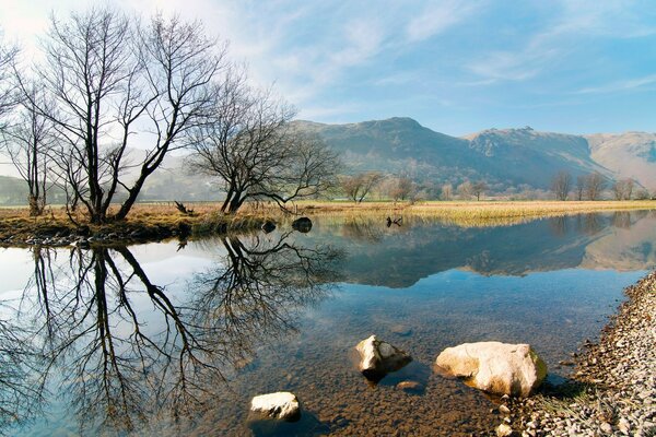 Landscape of mountains and rocks by the water