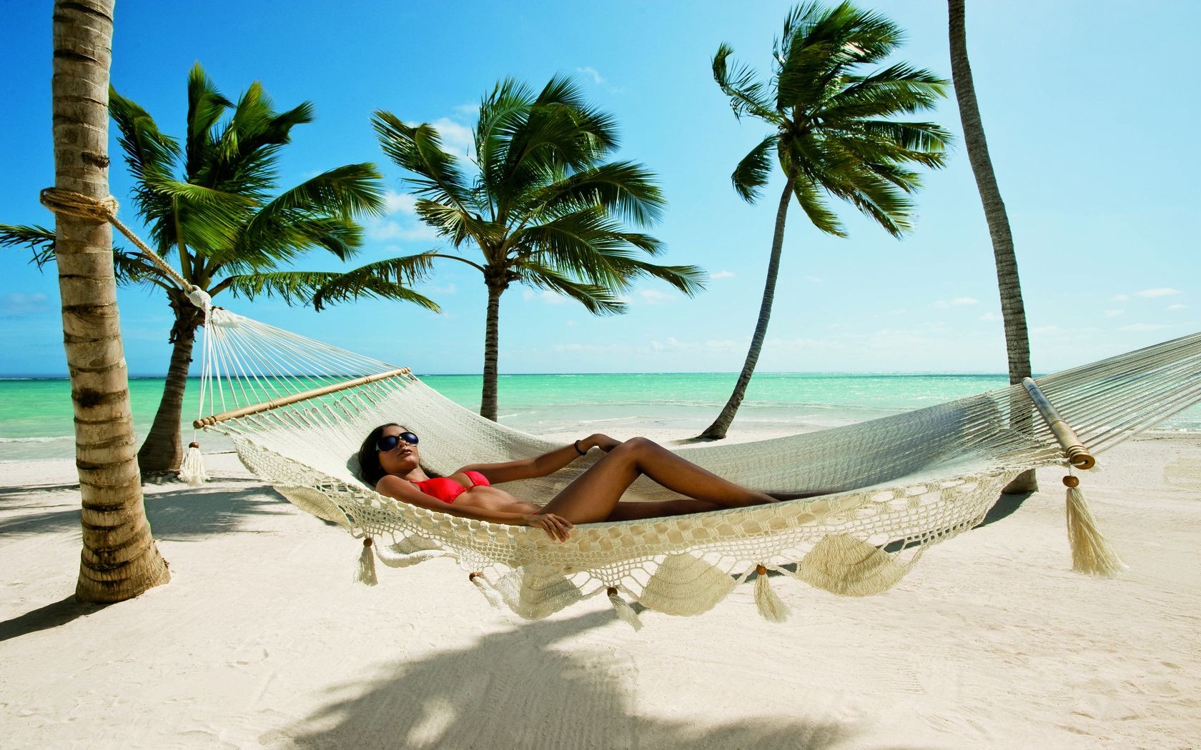 lying on back beach tropical sand travel vacation ocean relaxation water summer seashore resort hammock sun leisure idyllic sea island exotic paradise fair weather