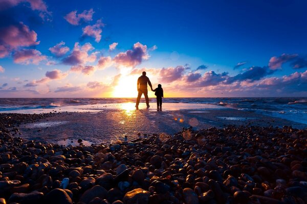 Atmospheric sunset on the beach by the ocean