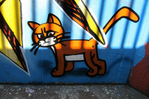 A painted cat on the garage
