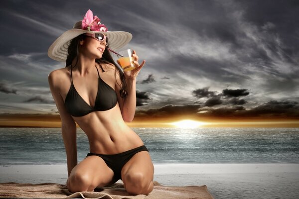 A girl in a swimsuit on the background of the ocean