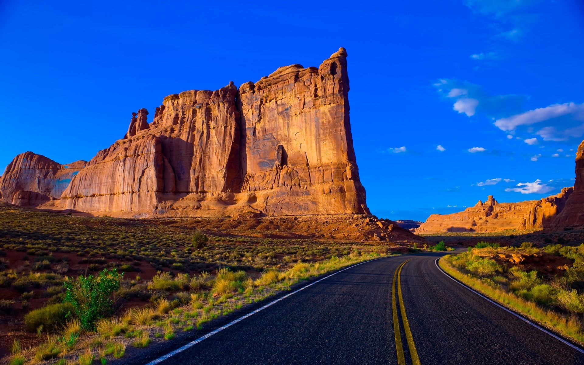 famous places travel outdoors desert rock sandstone sky landscape nature scenic canyon mountain valley geology sunset remote road arid daylight
