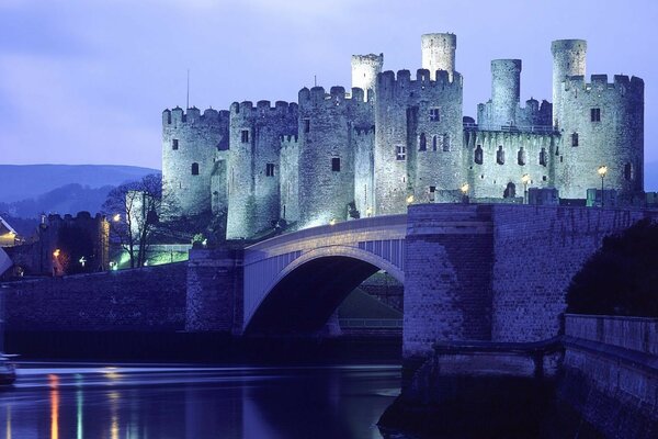 An unusual evening castle with a bridge