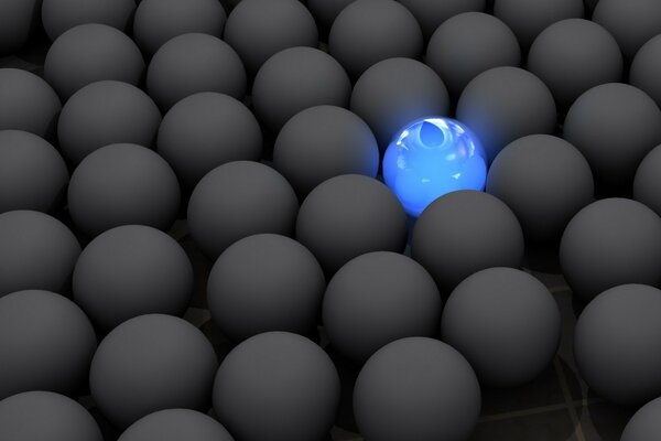 A glowing blue ball among a mass of the same gray balls