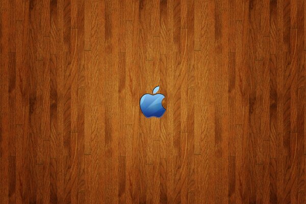 A blue apple on a woody background