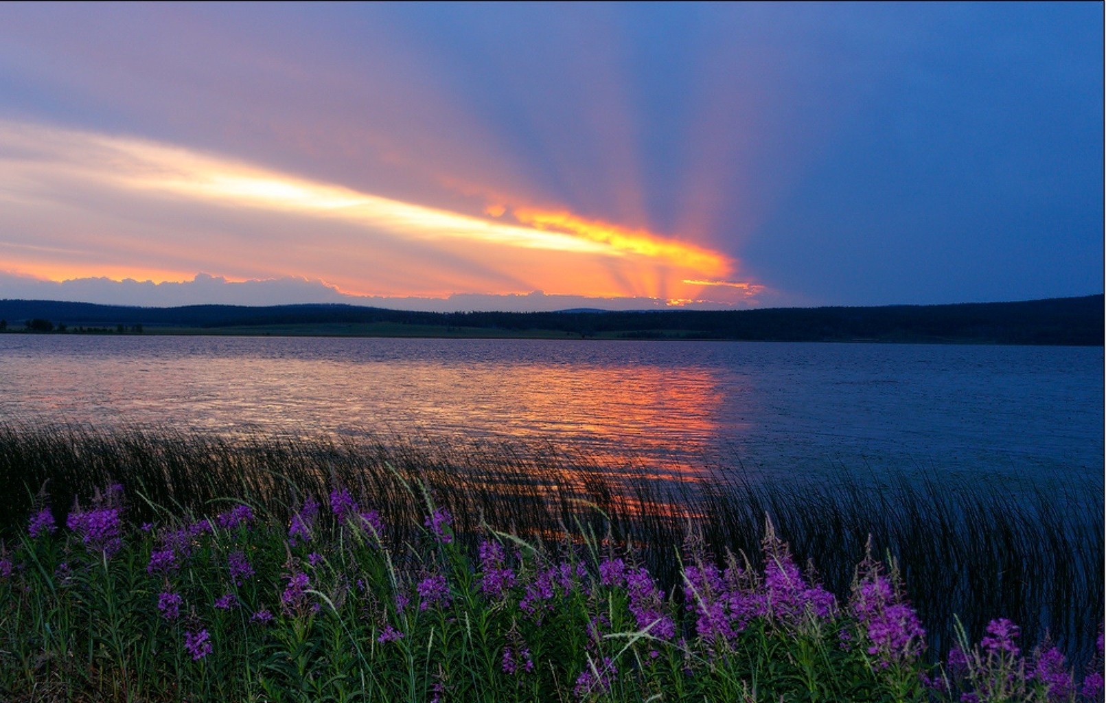 the sunset and sunrise dawn sunset landscape nature sun summer water evening outdoors sky fair weather dusk lake