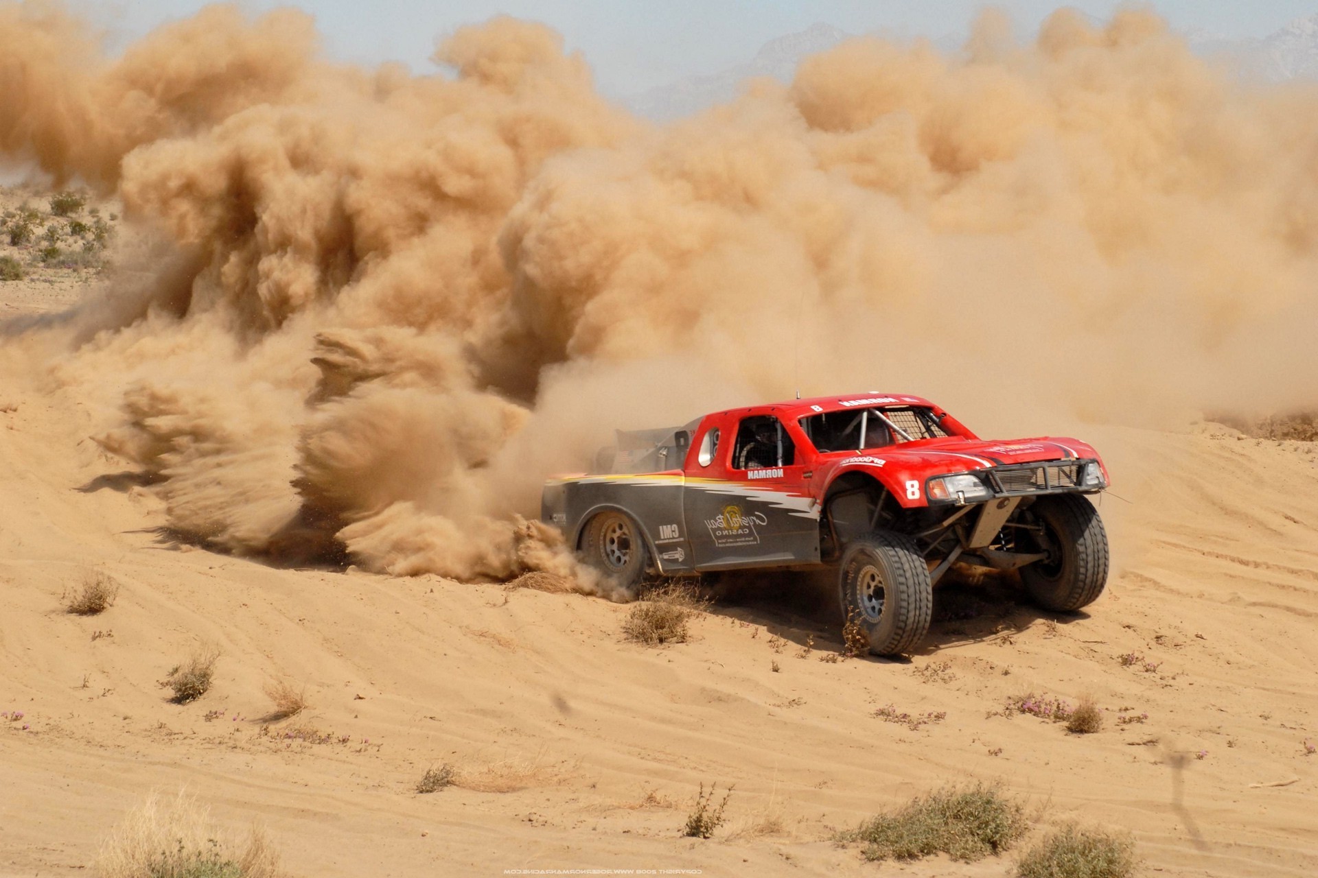 racing vehicle desert dust sand landscape