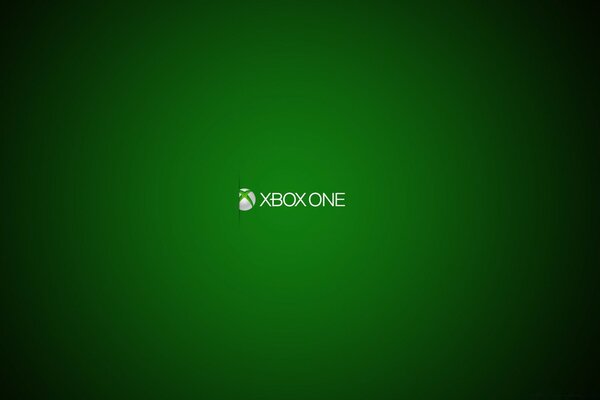 The logo of the Xbox One console in spotlight on a green background