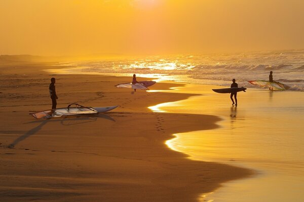 Surfers on the evening beach