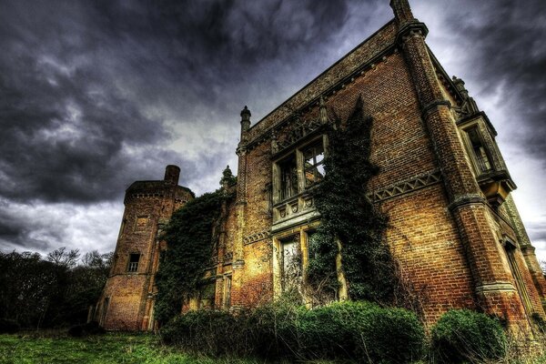 An ancient castle on the background of a menacing sky