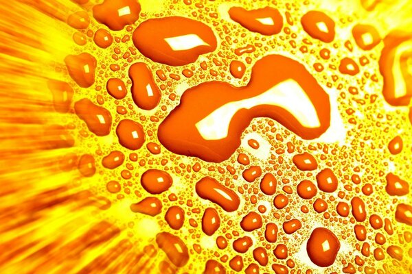 Water splashes on a yellow background