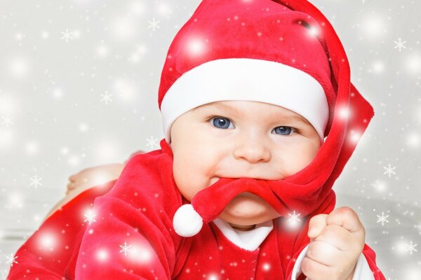 A cute little child in a New Year s hat
