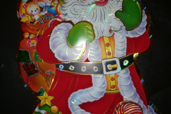 Santa Claus postcard with a bag of gifts