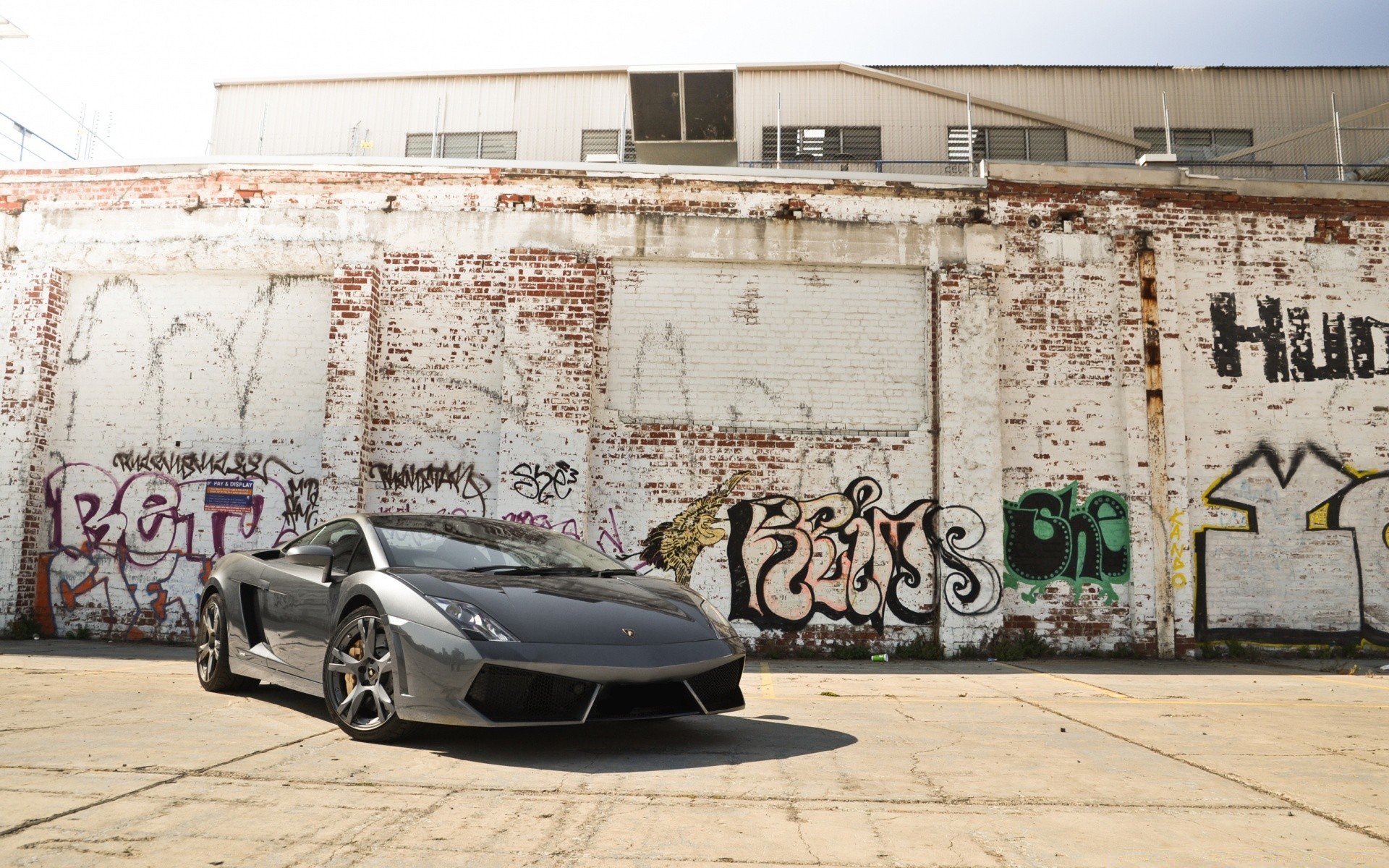cars graffiti street vehicle wall vandalism urban abandoned outdoors car war transportation system city