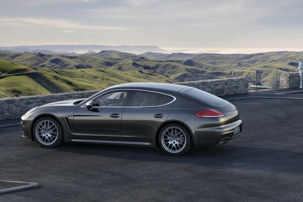 The car is the color of black, like asphalt