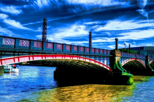 Bridge over a pond under a gloomy sky
