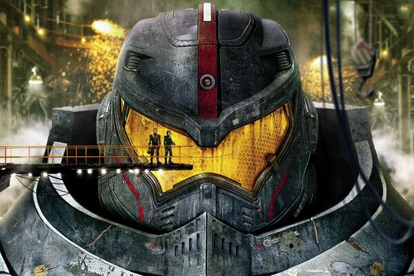 Two people on the background of a steel robot