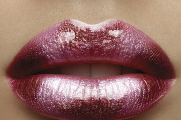 Lips brightly painted with lipstick