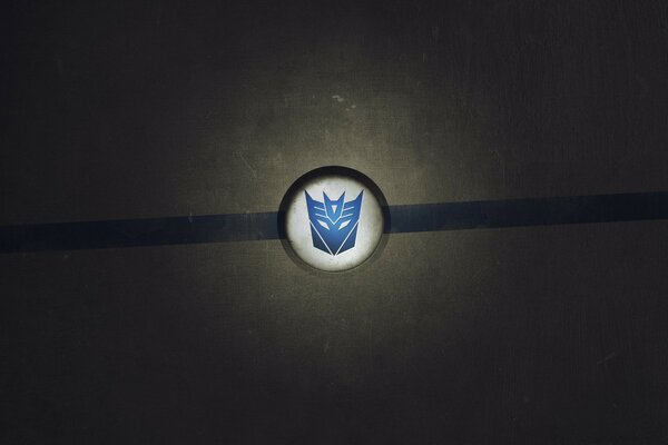 The Transformers sign is blue on a white background