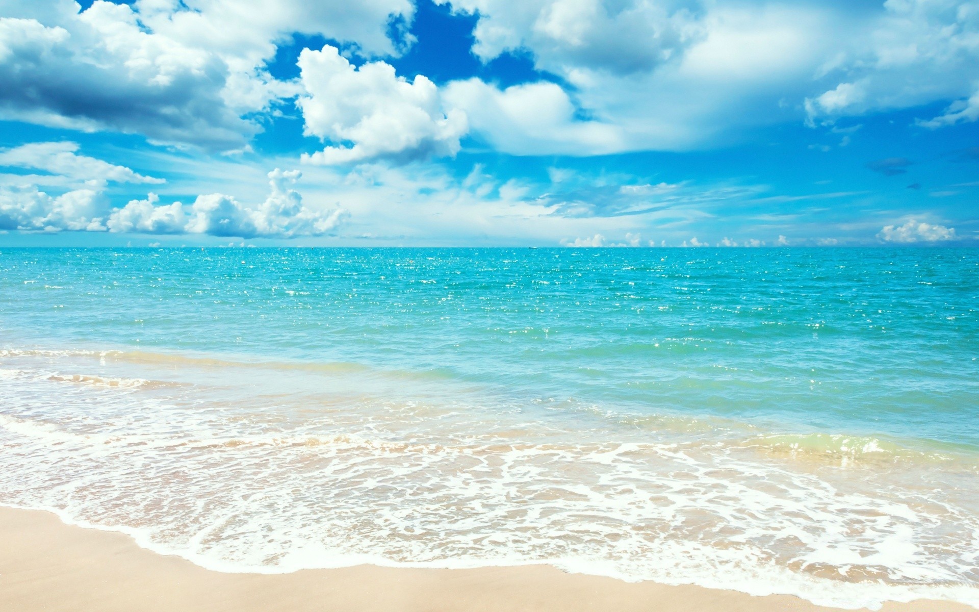 sea and ocean sand water surf tropical summer sun beach fair weather travel relaxation sky nature sea seascape ocean hot idyllic turquoise seashore